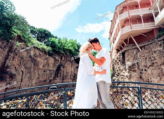 Guy with a girl standing on bridge, Tbilisi, Abanotubani district