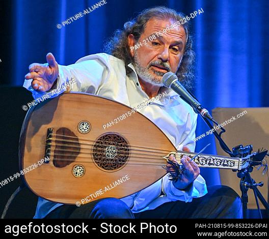 13 August 2021, Brandenburg, Neuhardenberg: Rabih Abou-Khalil, musician, with an oud (short-necked lute), at the concert for the summer programme of Schloss...