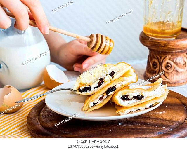 thin pancakes stuffed with cheese, prunes and sour cream, add ho