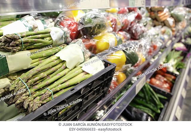 Green asparagus displayed on supermaket. Organic vegetables area