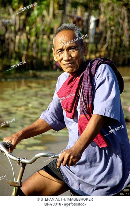 Khmer man on his bicycle near Kompong Thom Cambodia