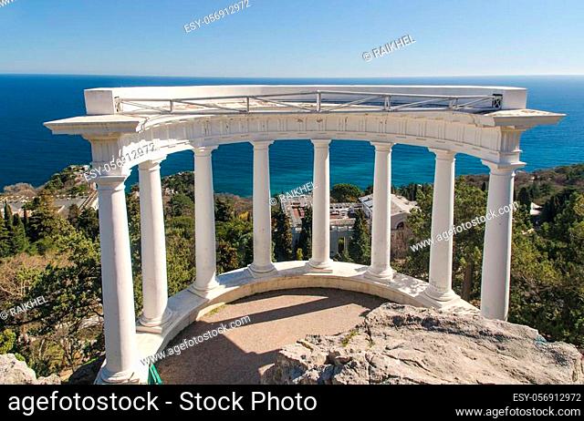 white colonnade over the sea at sunny day