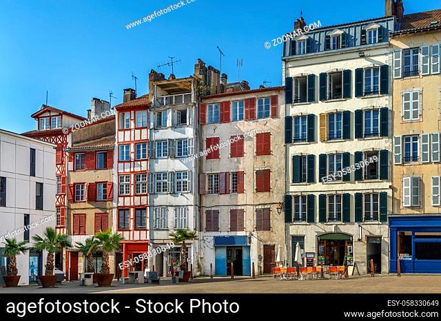 Street with historical houses in Bayonne city center, France