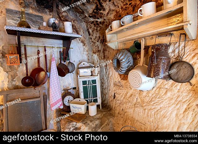 Germany, Saxony-Anhalt, Langenstein, kitchenette in a cave dwelling in Langenstein in the Harz Mountains. The cave dwellings in Langenstein were carved in...
