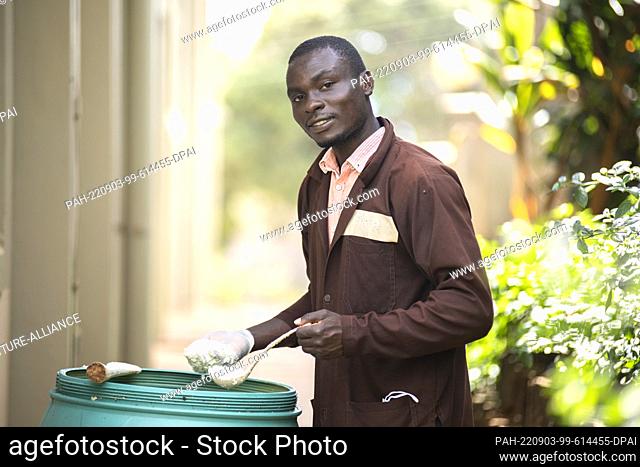 PRODUCTION - 22 August 2022, Uganda, Kitende: Blasio Kawere, co-founder of Sparkle Agro Brands, stands next to a bucket of fermented sour milk that the company...