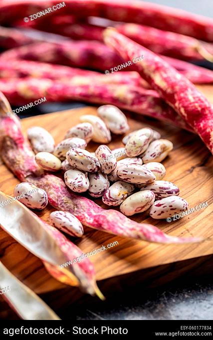 Cranberry beans. Beans pods on a cutting board