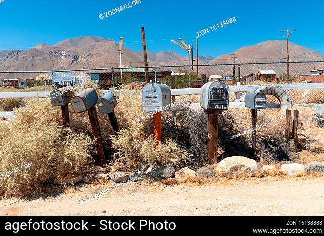 Vintage aged mailboxes in in California desert near Ridgecrest, USA. September, 26th, 2020