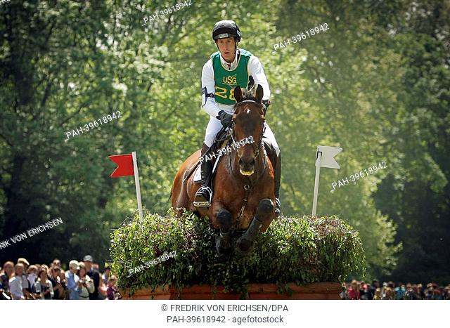 German eventer Dirk Schrade junps over an obstacle with his horse 'King Artus' in Wiesbaden, Germany, 18 May 2013. The horse 'King Artus' died of a ruptured...