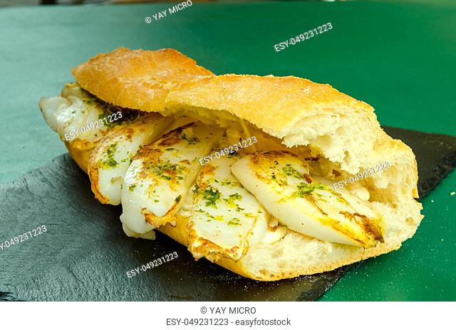 sepia sandwich with green sauce with garlic and parsley