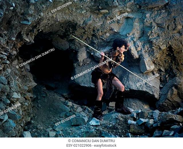 cavewoman hunting with spear