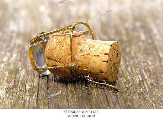 champagne cork on wooden table