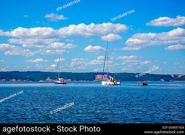 Two Sailing Boats and One Motor Boat on the River