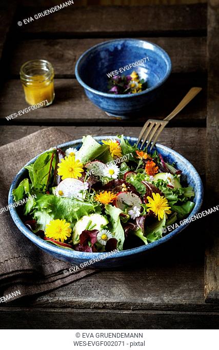 Bowl of mixed salad with edible flowers