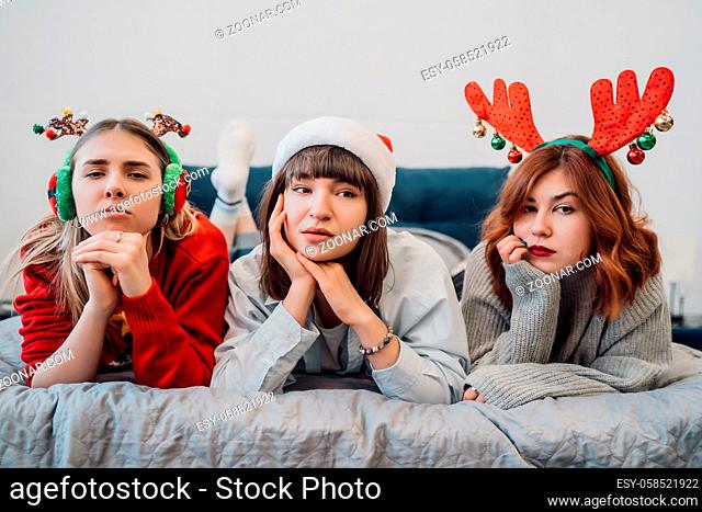 Beautiful Friends In Home Clothes. Gorgeous Smiling Female Models Having Fun And Enjoying Pajamas Party In Light Home Interior