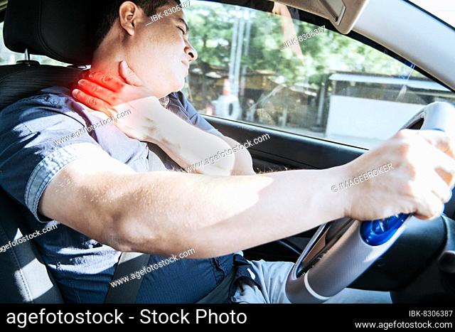 A driver with neck pain, concept of a man in his car with neck pain. An exhausted driver with neck pain in traffic, A person with neck pain in traffic