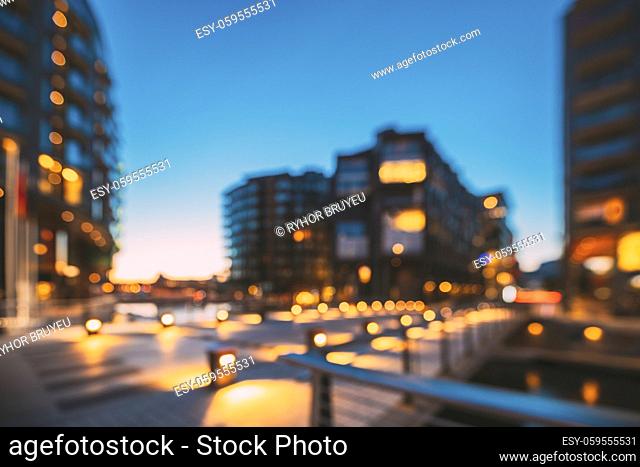 Oslo, Norway. Night Abstract Boke Bokeh Background Effect. Residential Multi-storey Houses In Aker Brygge District. Summer Evening