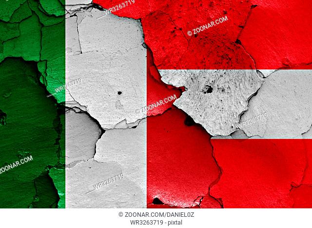 flags of Italy and Austria painted on cracked wall