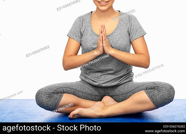 woman doing yoga in lotus pose