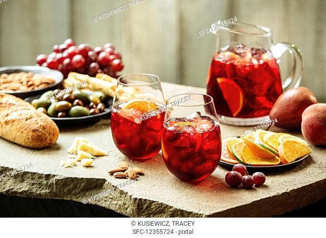 Sangria with fruit, olives and almonds