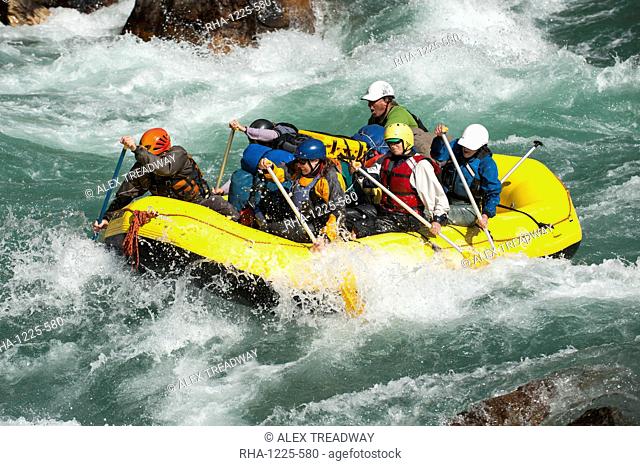 Rafters get splashed as they go through some big rapids on the Karnali River, west Nepal, Asia