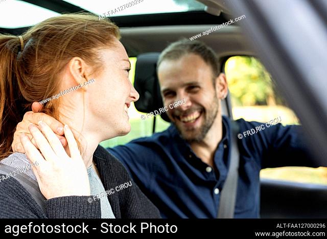 Smiling young couple enjoying road trip, Orgeval