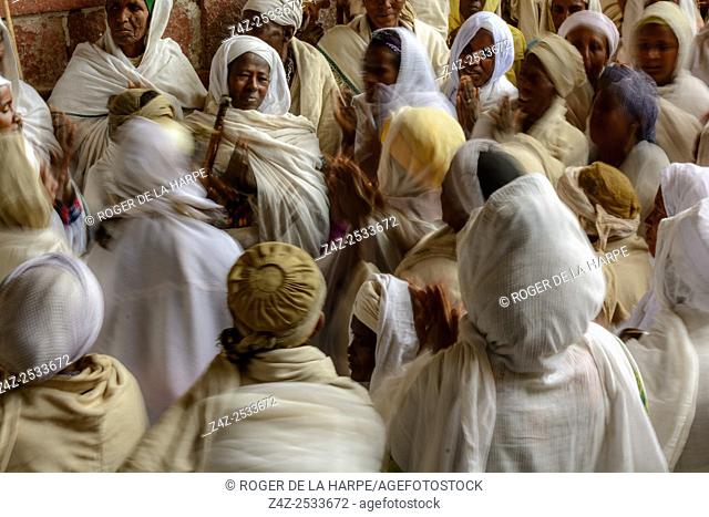 Pilgrims at a Christian religious ceremony in a cave (where there is a source of Holy Water) at St. Neakutoleab Monestry near Lalibela. Ethiopia