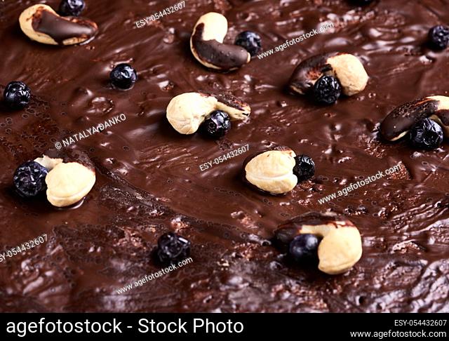 texture of baked brownie chocolate cake with chocolate poured. Cooked homemade food. Chocolate pastry. Sweet meal, homemade dessert
