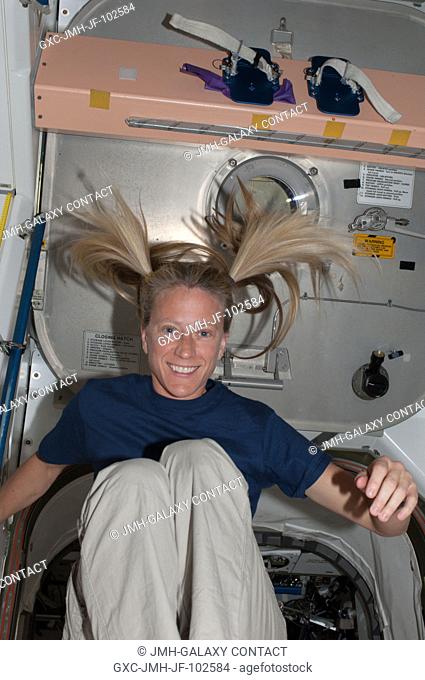 It's recess time for a floating astronaut Karen Nyberg, Expedition 36 flight engineer, in the Unity node aboard the International Space Station