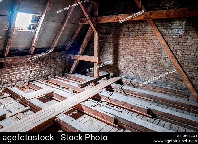 roof beams in attic / loft during before renovation / construction -