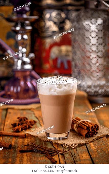 Dairy smoothie with cinnamon in a large glass