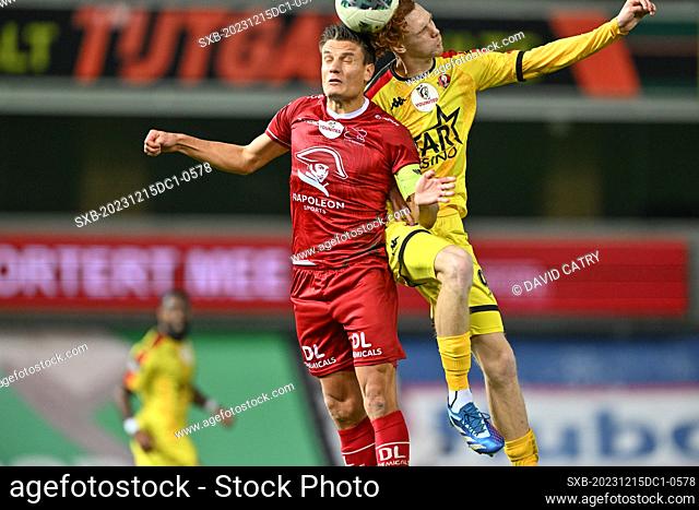 Jelle Vossen (9) of Zulte-Waregem pictured fighting for the ball with Lilian Raillot (97) of FC Seraing during a soccer game between SV Zulte Waregem and...