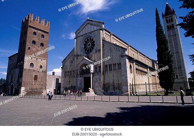 Basilica di San Zeno Maggiore, exterior between bell tower on the right and another, crenellated tower on the left