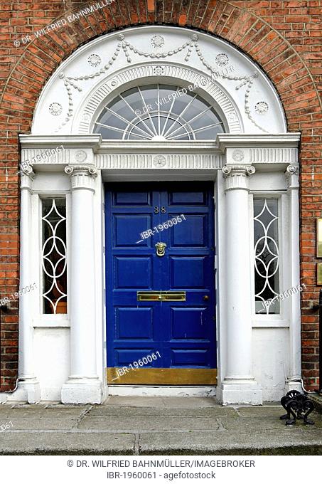 Blue front door of a terraced house near Merrion Park, Dublin, Republic of Ireland, Europe