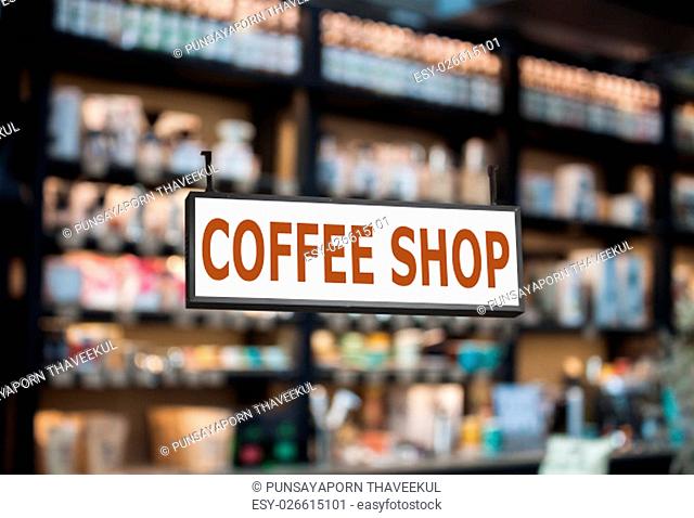 Coffee shop signboard with cafe blurred background, stock photo