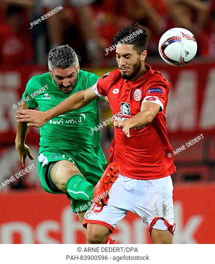 Mainz's Suat Serdar (R) and Saint-Etiennes Loic Perrin vie for the ball during the Europa League grouup C football match between 1