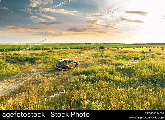 Gomel, Belarus - July 20, 2020: Elevated View Of Renault Duster Car SUV Parked Near Countryside Road In Summer Field Rural Landscape