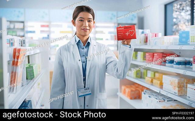 Pharmacist holding a box of pills