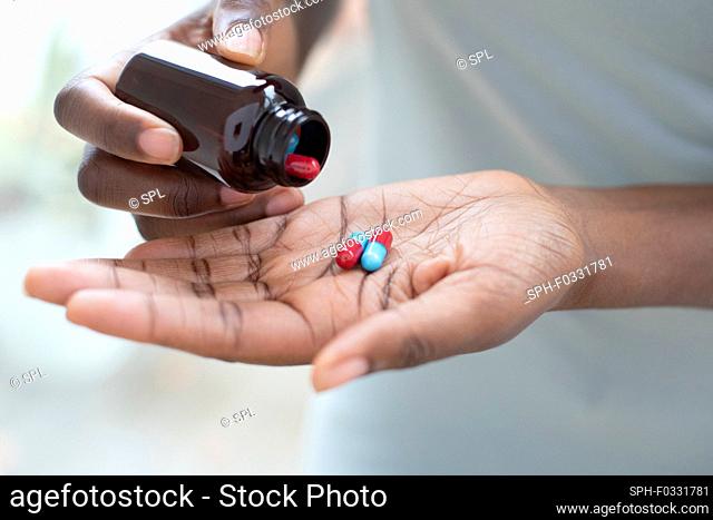 Pouring pills into hand