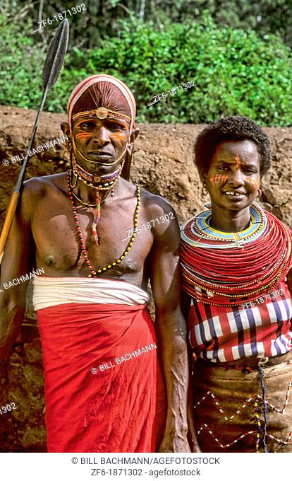 Maasai tribe people couple in costume traditional dress in jungles near hut near Kenya Africa
