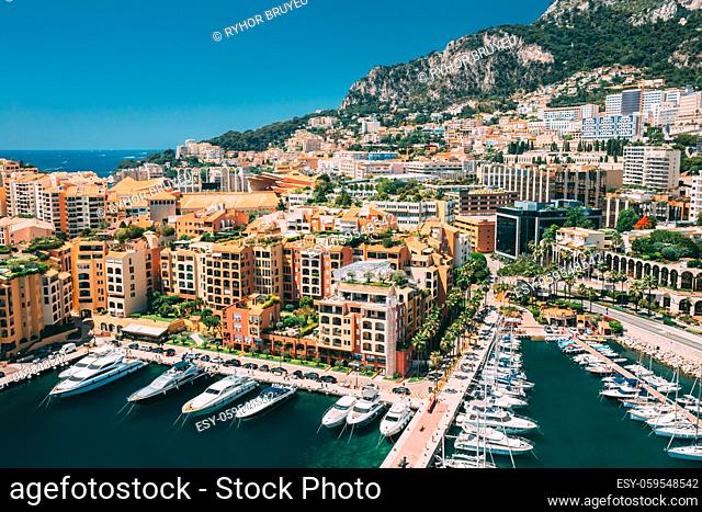 Monaco, Monte Carlo. Yachts Moored Near City Pier, Jetty In Sunny Summer Day. Monaco, Monte Carlo Cityscape Skyline