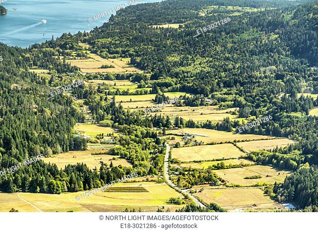 Canada, BC, Saltspring Island. View of farms in the Fulford Valley from Mount Maxwell