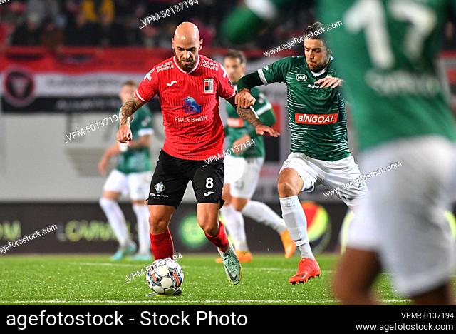 Rwdm's Bryan Smeets and Lommel's Theo Pierrot pictured in action during a soccer match between RWD Molenbeek and Lommel SK, Sunday 13 November 2022 in Brussels