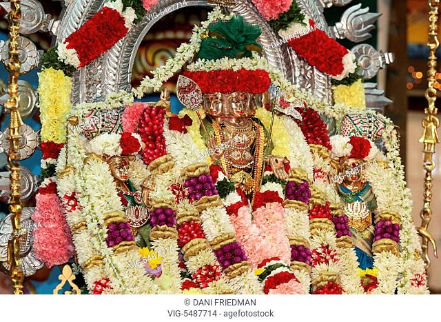 CANADA, BRAMPTON, 08.08.2015, Adorned idol of Lord Murugan and his two wives Goddess Valli Ammai and Goddess Theivayaanai during the Aadivel Festival (Aadi Vel...