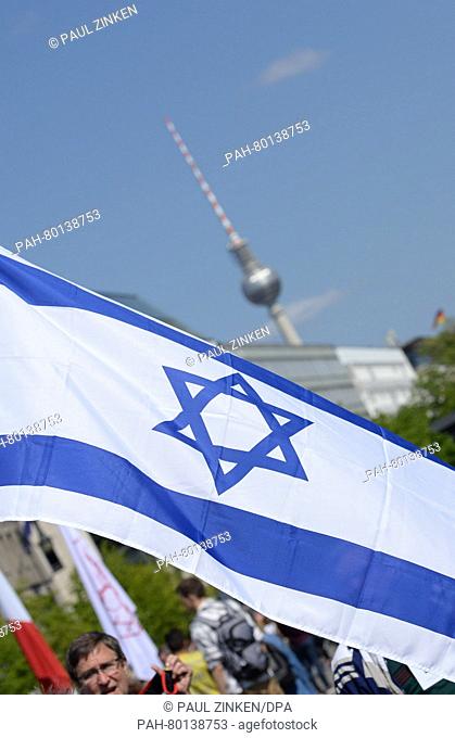 An Israeli flag waves on Pariser Platz in Berlin, Germany, 05 May 2016. The 'March of the Living' event for Holocaust Remembrance Day Yom HaShoah took place...