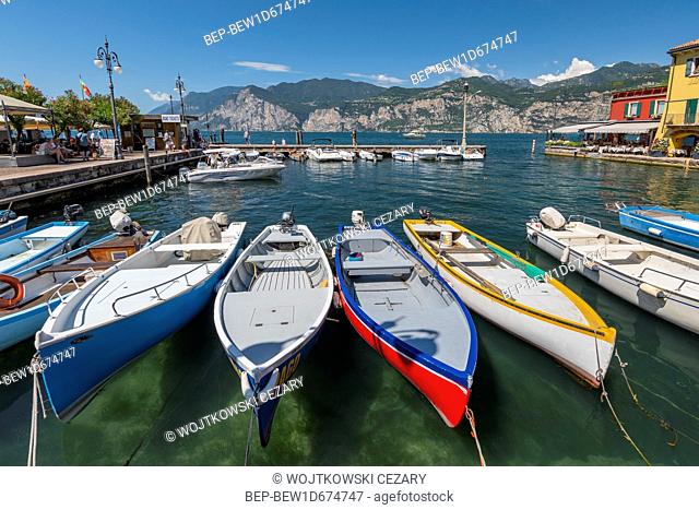 Fishing boats in the harbour of Malcesine village, Lake Garda, Italy