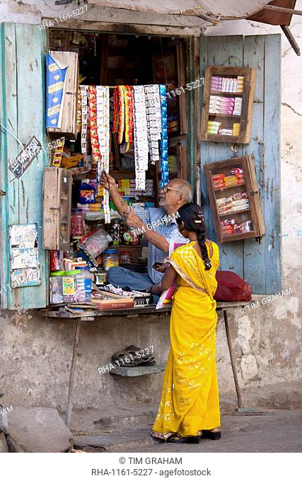 Young Indian woman out shopping in old town Udaipur, Rajasthan, Western India