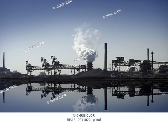 Nuclear power plant reflected in still lake, Detroit, Michigan, United States