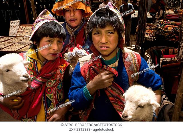 Children dressed in traditional costume in Pisac Sunday market day. Pisac. Sacred Valley. Pisac, or Pisaq in Quechua, is a small town about 35 km from Cuzco