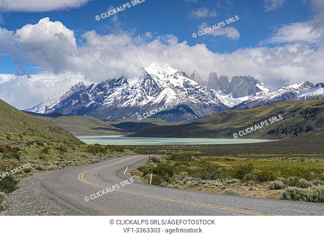 Road to Laguna Amarga, with Paine Towers in the background in summer. Torres del Paine National Park, Ultima Esperanza province, Magallanes region, Chile