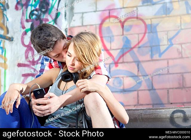Germany, Berlin, Teenage couple falling in love